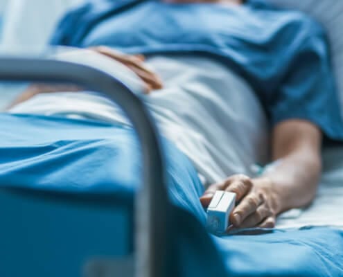 patient lying in hospita bed