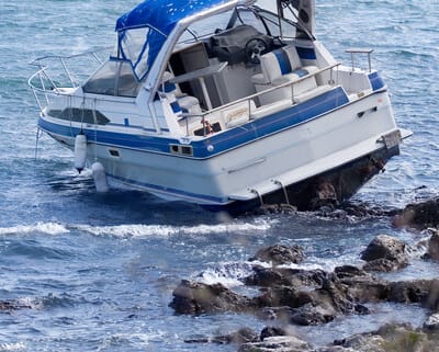Who pays for injuries suffered in a boating accident in Miami, Florida?
