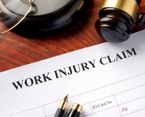 What type of legal recourse can a person take after suffering an injury at work?